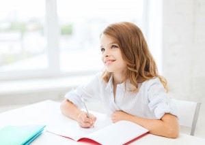 young girl writing