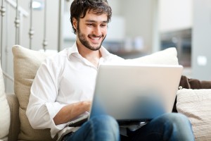 freelance writer planning his website content on laptop