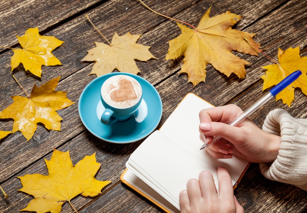 woman practising copywriting skills in a notebook