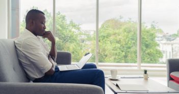 How to Find Your Writing Niche in 4 Easy Steps Man finding his writing niche on laptop