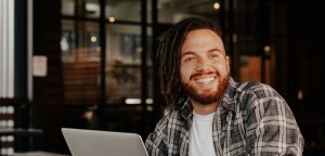 Man on patio on laptop