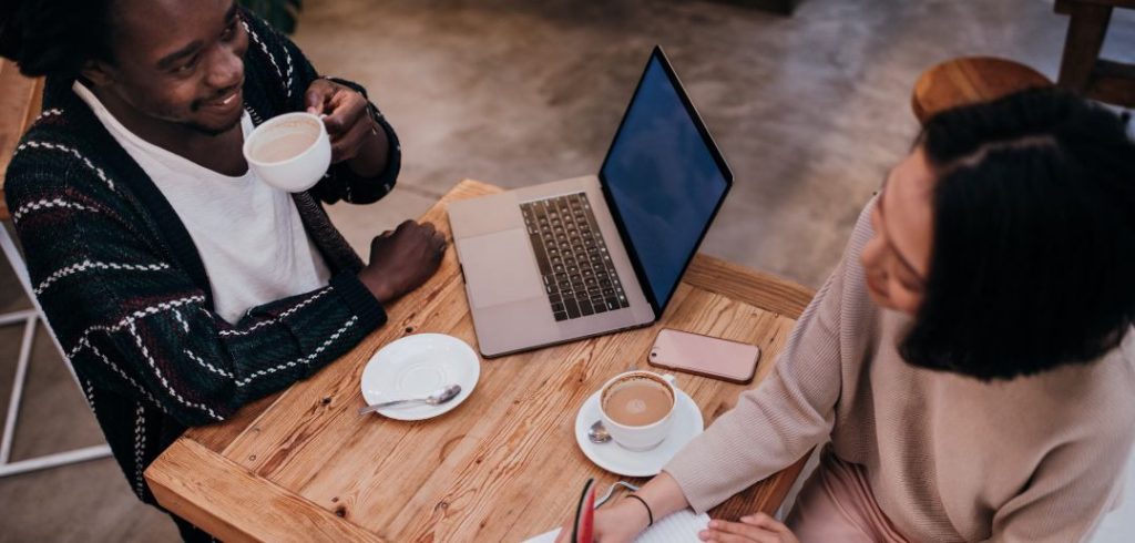 man and woman networking over coffee