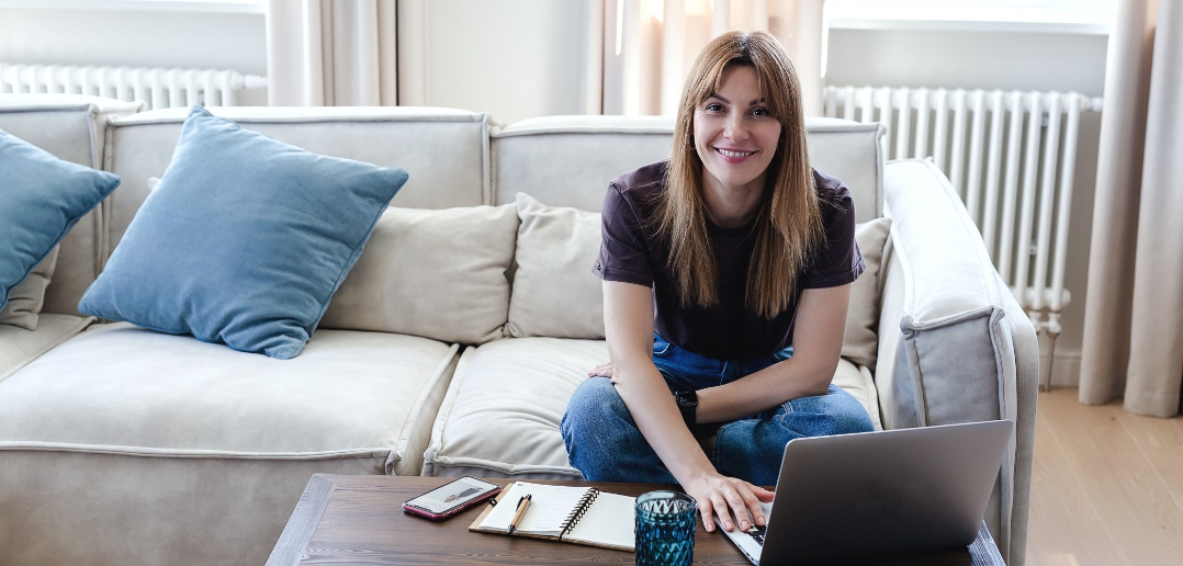 woman working on laptop on coffee table