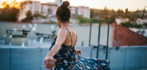 woman dancing on building rooftop