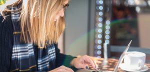 woman practicing writing skills on laptop