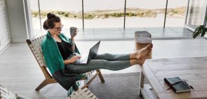 woman working on client free writing business on laptop