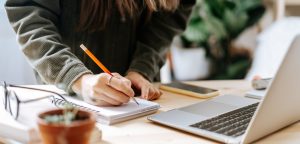 woman writing a sales letter using formula