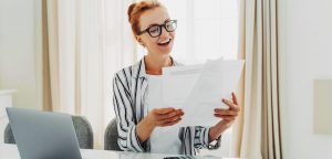 woman making her own invoice on computer