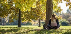 writer under trees learning how to write for cause marketing